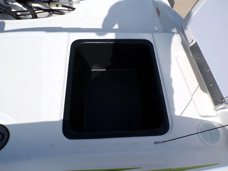 Slide: The Image of 2024 Tahoe T18 boat storage compartment, open and empty. - 15