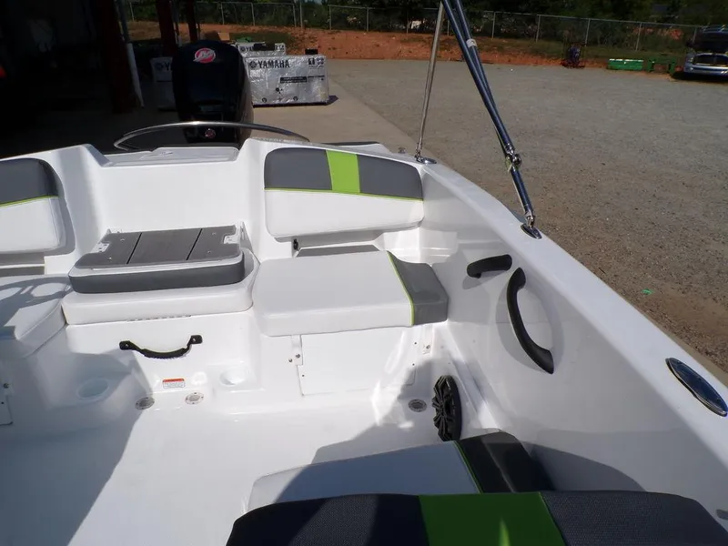 Slide: The Image of 2024 Tahoe T18 boat interior with gray and green seating. - 25