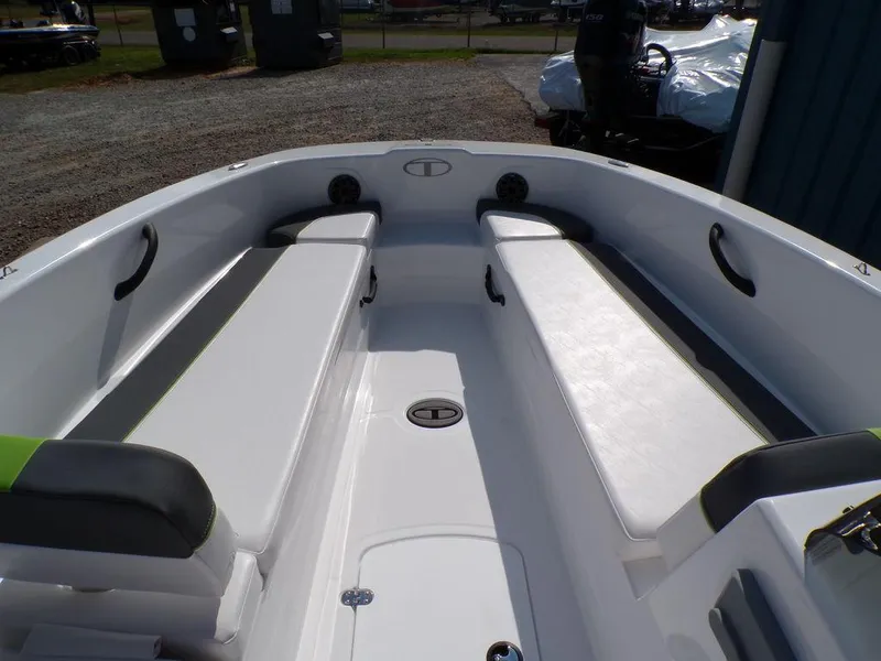 Slide: The Image of 2024 Tahoe T18 boat interior with white seating and storage compartments. - 27