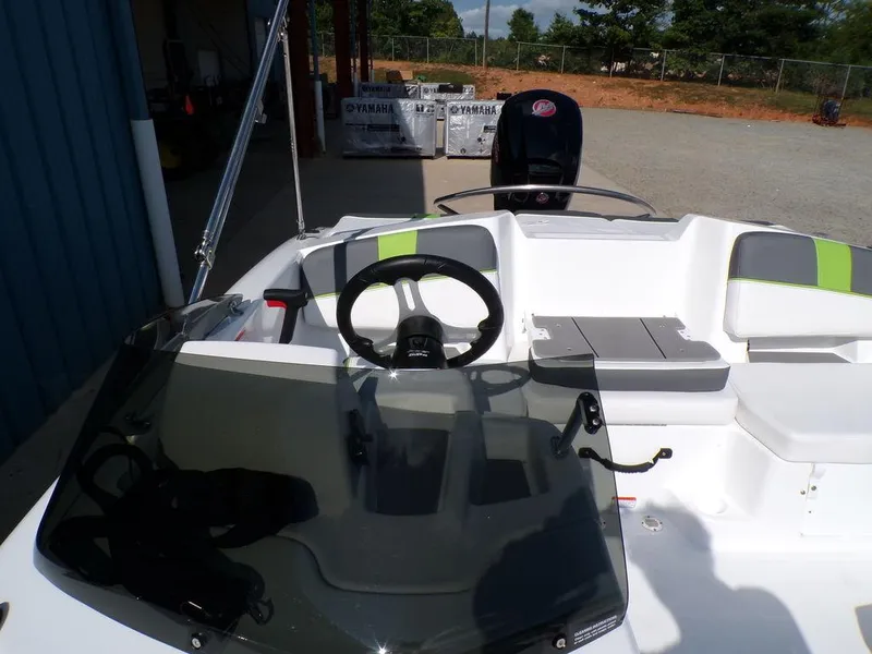 Slide: The Image of 2024 Tahoe T18 boat cockpit with steering wheel and seating area. - 4