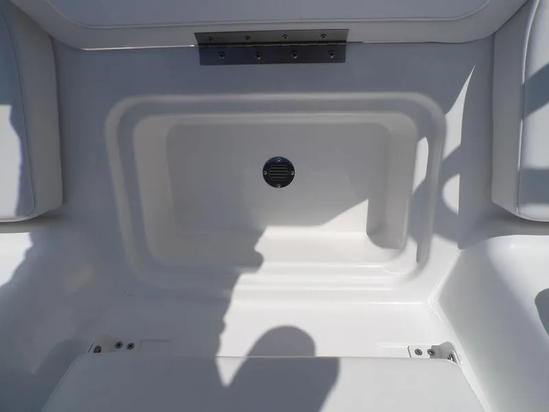 Slide: The Image of 2024 Tahoe T18 boat interior storage compartment, white finish, with shadow and light contrast. - 5