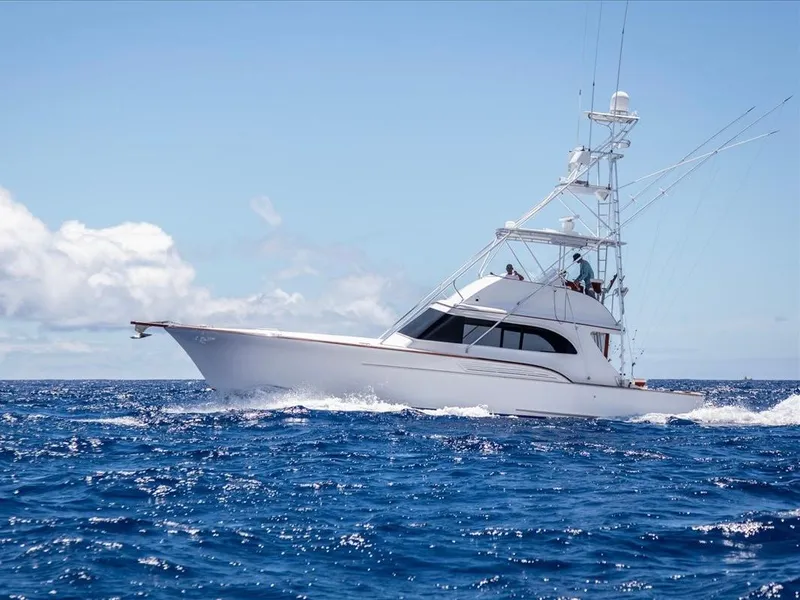 Slide: The Image of 1997 Buddy Davis Sportfisher Convertible yacht cruising on open ocean. - 20