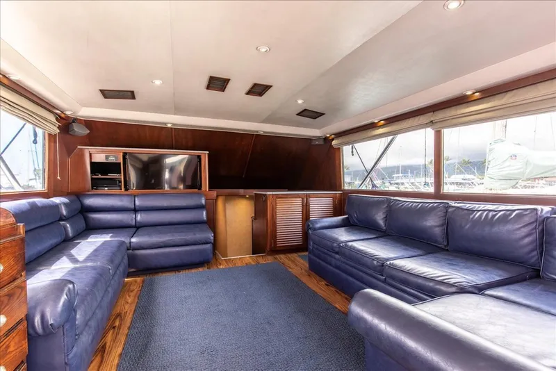 Slide: The Image of Luxurious interior of 1997 Buddy Davis Sportfisher Convertible with blue leather seating. - 22