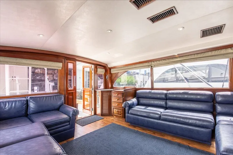 Slide: The Image of Luxurious interior of a 1997 Buddy Davis Sportfisher Convertible with blue leather seating. - 23