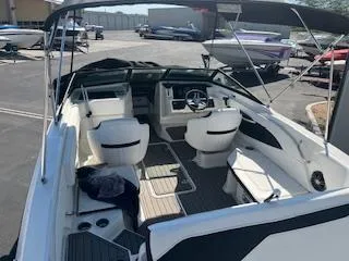 Slide: The Image of 2023 Sea Ray SPX 210 boat interior with seating and steering wheel. - 26