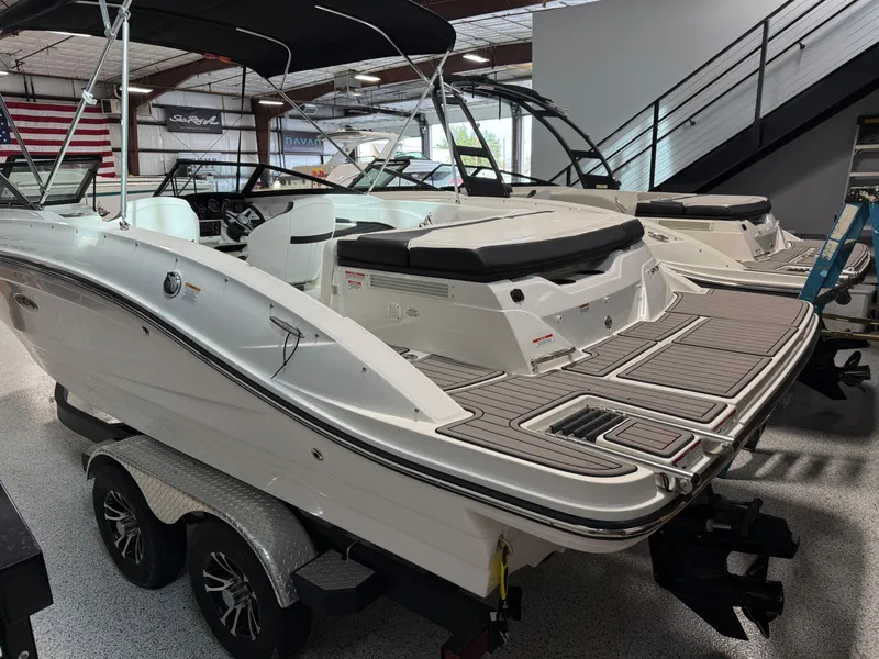 Slide: The Image of 2023 Sea Ray SPX 210 boat in showroom, featuring sleek design and modern amenities. - 3