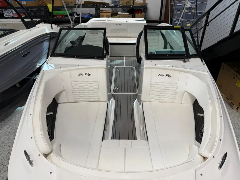 Slide: The Image of 2023 Sea Ray SPX 210 boat interior with white seating and sleek design. - 6