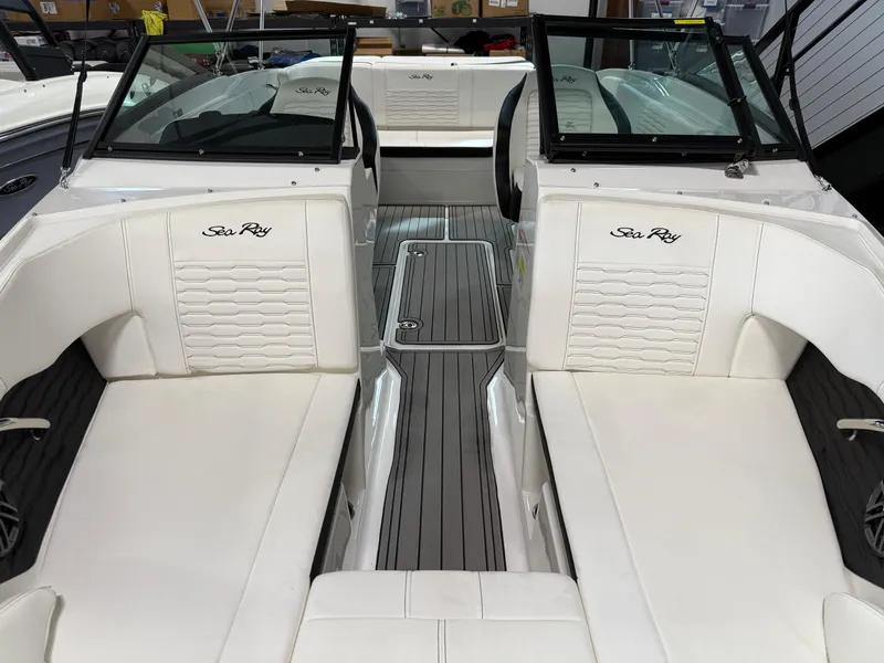 Slide: The Image of 2023 Sea Ray SPX 210 boat interior with white seating and sleek design. - 7