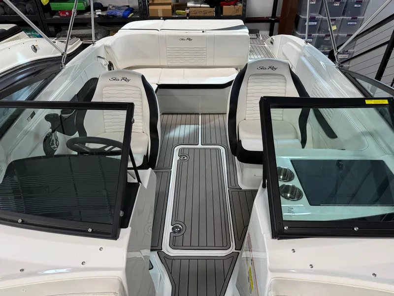 Slide: The Image of 2023 Sea Ray SPX 210 boat interior with white seating and sleek design. - 9