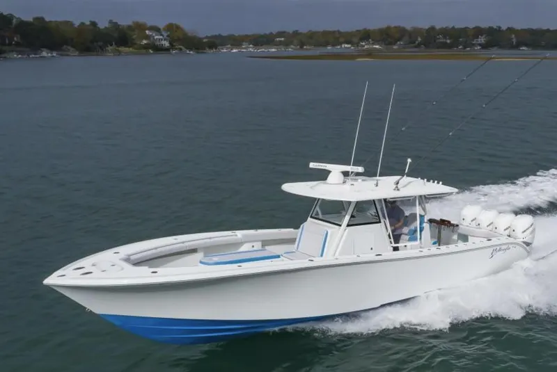 Slide: The Image of 2018 Yellowfin 39 boat cruising on a calm lake. - 1
