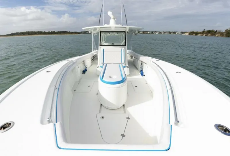 Slide: The Image of 2018 Yellowfin 39 boat on calm water with spacious deck. - 13