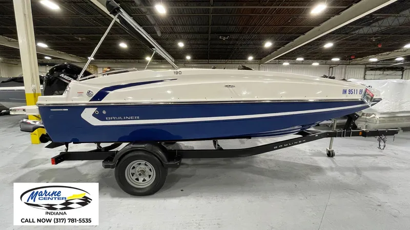 Slide: The Image of 2019 Bayliner 190 Deck Boat on trailer in indoor showroom, Marine Center Indiana. - 1