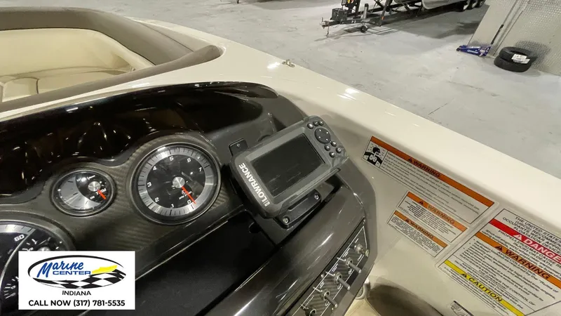 Slide: The Image of Dashboard of a 2019 Bayliner 190 Deck Boat with gauges and navigation system. - 11