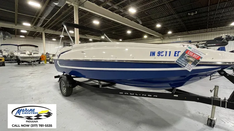 Slide: The Image of 2019 Bayliner 190 Deck Boat on trailer in showroom, priced at $30,857, Marine Center Indiana. - 5