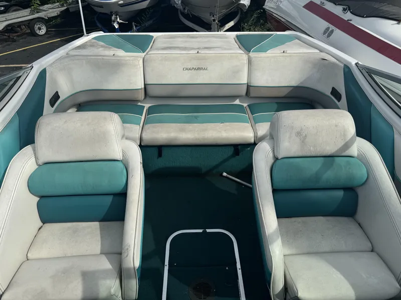 Slide: The Image of 1993 Chaparral 2000SL boat interior with teal and white seating. - 6