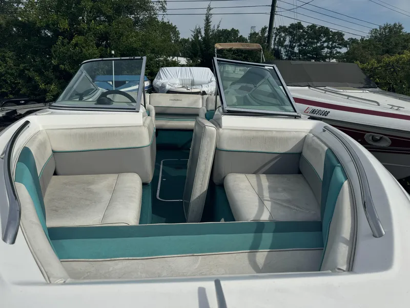 Slide: The Image of 1993 Chaparral 2000SL boat interior with white and teal seating. - 7