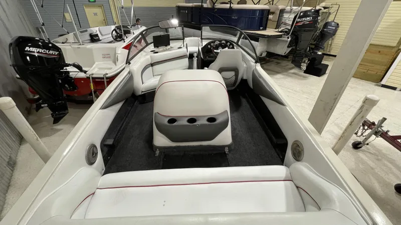 Slide: The Image of 1996 Tigé PRE2002WT boat interior with white seating and dashboard view. - 3