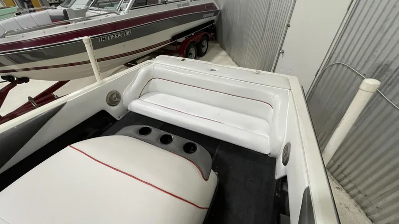 Slide: The Image of 1996 Tigé PRE2002WT boat interior with white seating and red accents. - 4