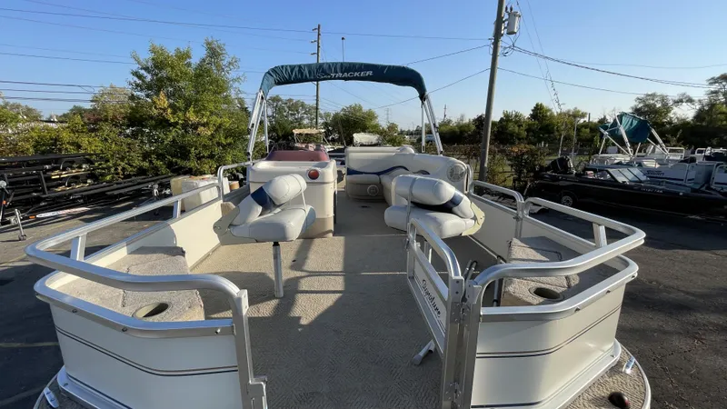 Slide: The Image of 2007 Sun Tracker Fishing Deck 21 pontoon boat with seating and canopy. - 11