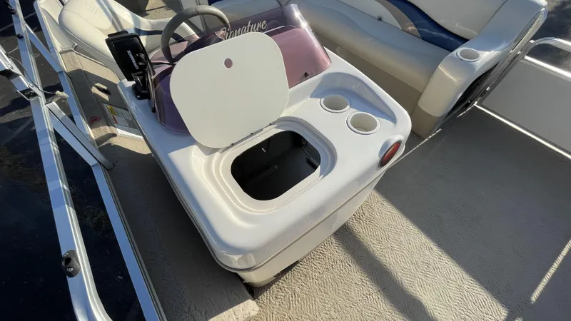 Slide: The Image of 2007 Sun Tracker Fishing Deck 21 boat console with steering wheel and cup holders. - 12