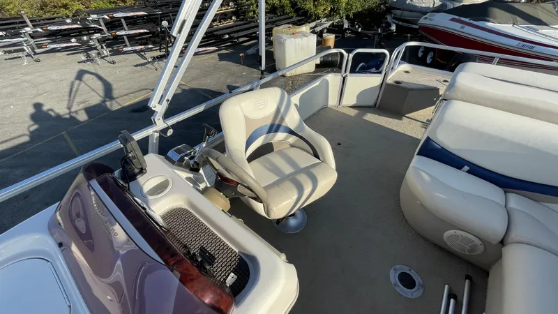 Slide: The Image of 2007 Sun Tracker Fishing Deck 21 interior with seating and control panel. - 16