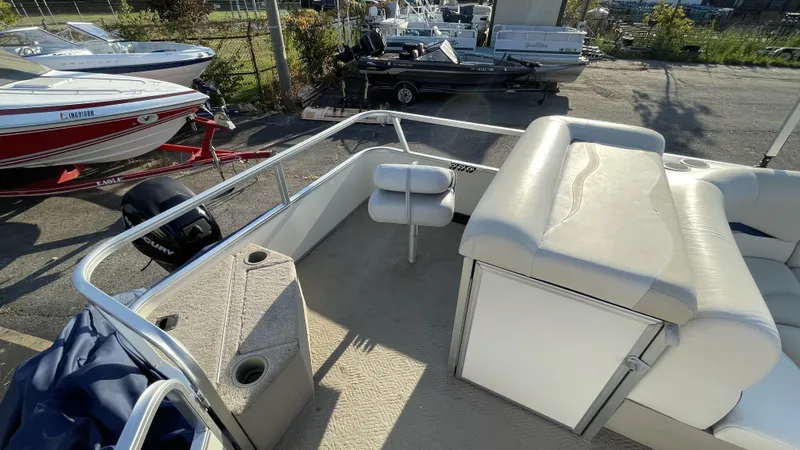 Slide: The Image of 2007 Sun Tracker Fishing Deck 21 boat interior with seating and storage. - 19