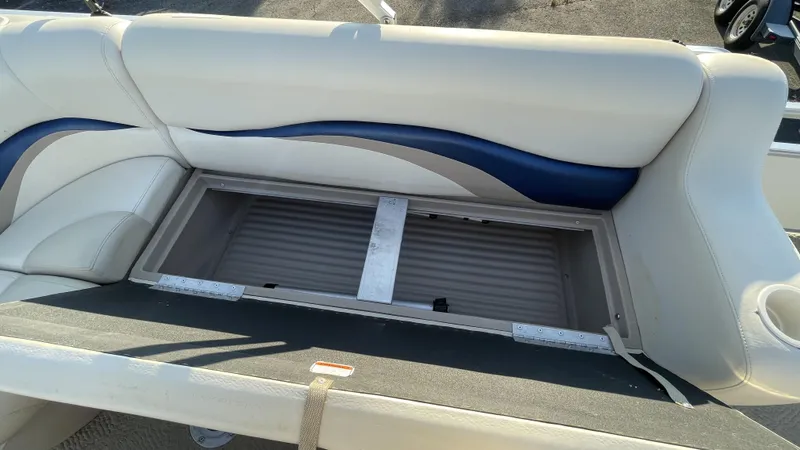 Slide: The Image of 2007 Sun Tracker Fishing Deck 21 boat seat with open storage compartment. - 3