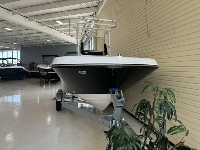 Slide: The Image of 2024 Bayliner TROPHY CC20 boat on display in indoor showroom. - 6