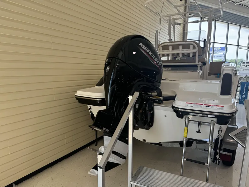 Slide: The Image of 2024 Bayliner TROPHY CC20 boat with Mercury outboard motor in showroom. - 7