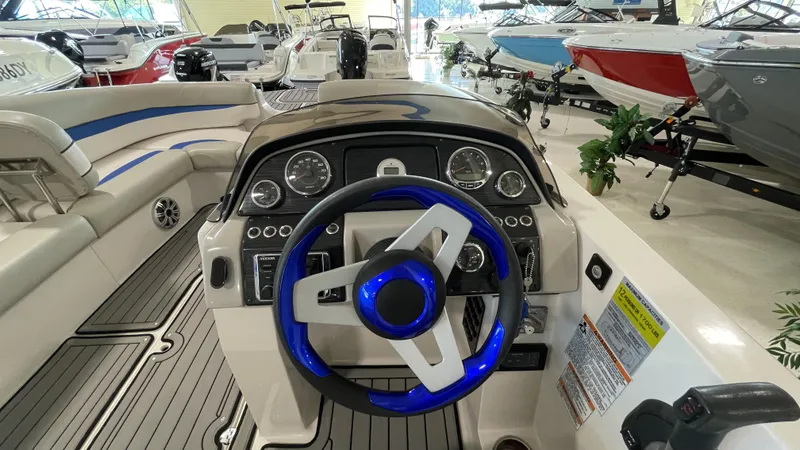 Slide: The Image of 2019 Starcraft Starstep 221 boat interior with modern dashboard and steering wheel. - 10