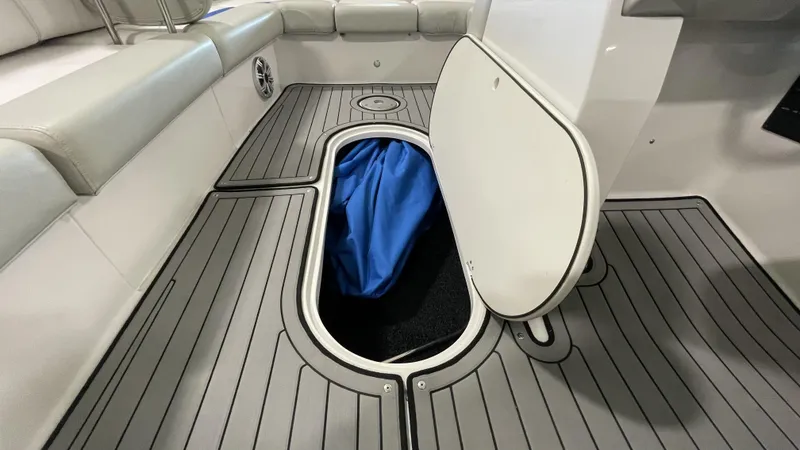 Slide: The Image of 2019 Starcraft Starstep 221 boat interior with open storage compartment. - 4