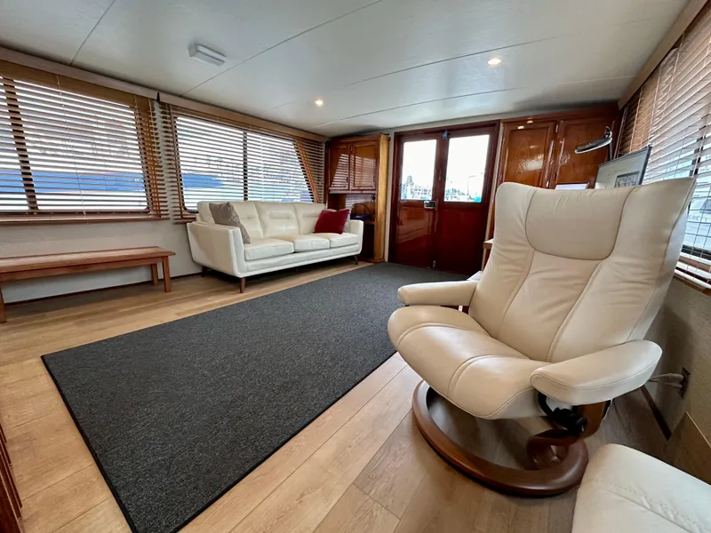 Slide: The Image of Interior of a 1976 Ditmar & Donaldson Custom Yachtfisher, featuring elegant seating and wooden accents. - 11