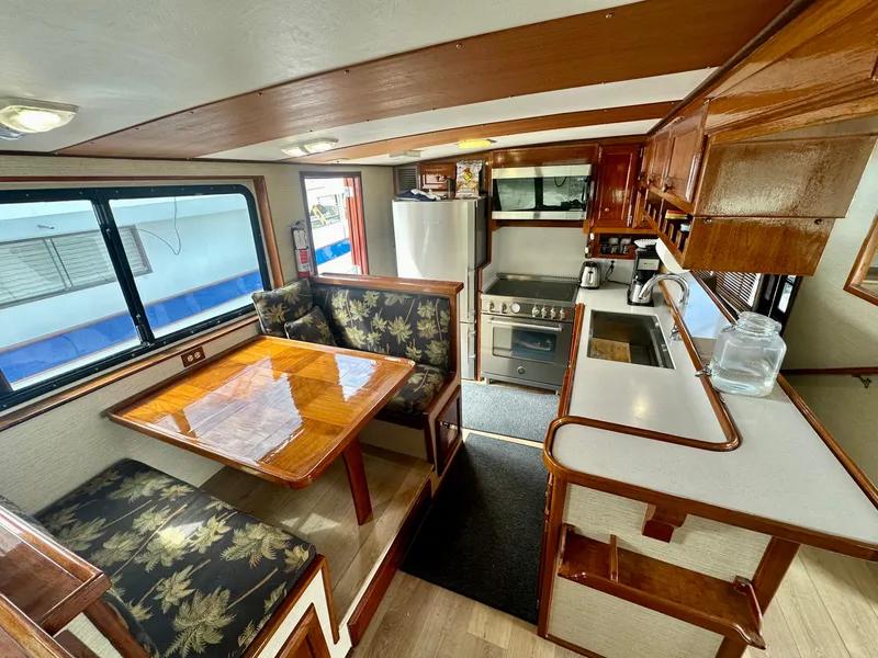 Slide: The Image of Interior of 1976 Ditmar & Donaldson Custom Yachtfisher with kitchen and dining area. - 16