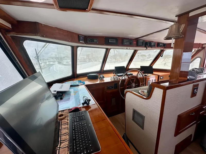 Slide: The Image of 1976 Ditmar & Donaldson Custom Yachtfisher interior with steering wheel and navigation equipment. - 19