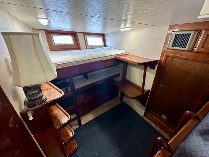 Slide: The Image of 1976 Ditmar & Donaldson Custom Yachtfisher cabin with wooden interior and cozy sleeping area. - 29