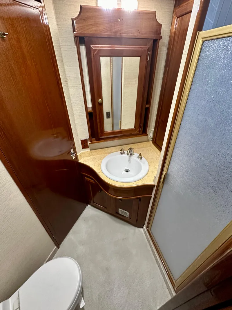 Slide: The Image of 1976 Ditmar & Donaldson Custom Yachtfisher bathroom with wood accents and compact design. - 30
