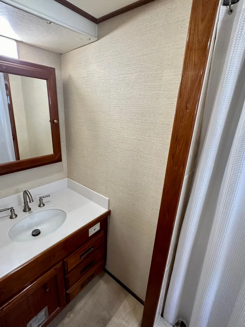 Slide: The Image of 1976 Ditmar & Donaldson Custom Yachtfisher bathroom with wood accents and modern sink. - 32