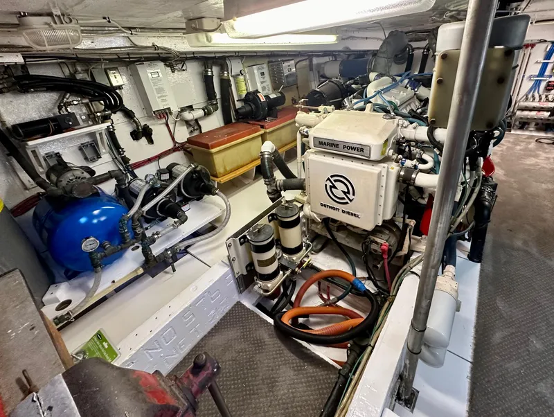 Slide: The Image of Engine room of a 1976 Ditmar & Donaldson Custom Yachtfisher, showcasing marine power systems. - 35