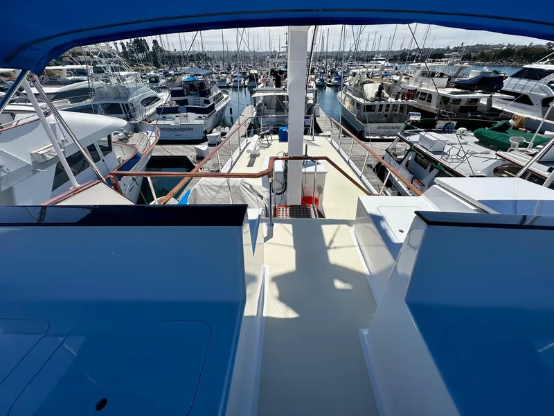 Slide: The Image of 1976 Ditmar & Donaldson Custom Yachtfisher docked in a busy marina. - 7