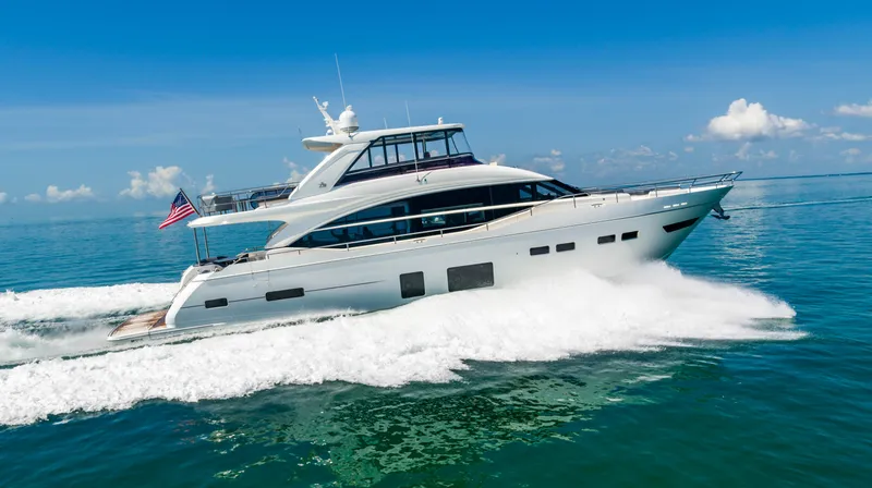 Slide: The Image of 2018 Princess Y75 Motor Yacht cruising on open water. - 13