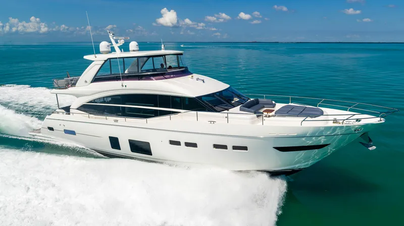 Slide: The Image of 2018 Princess Y75 Motor Yacht cruising on clear blue waters. - 14
