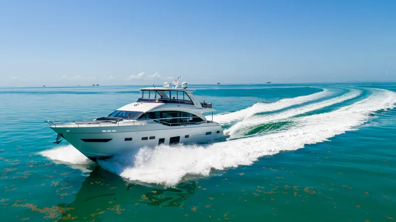 Slide: The Image of 2018 Princess Y75 Motor Yacht cruising on open water. - 15