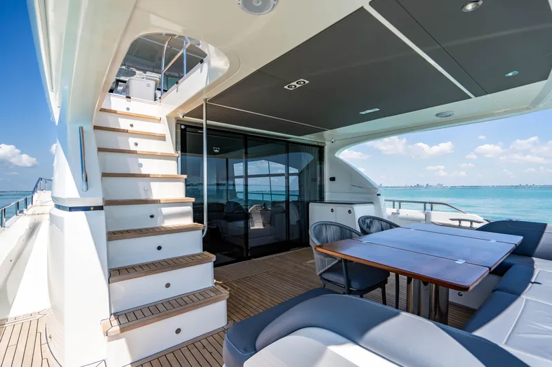 Slide: The Image of 2018 Princess Y75 Motor Yacht deck with seating area and ocean view. - 22