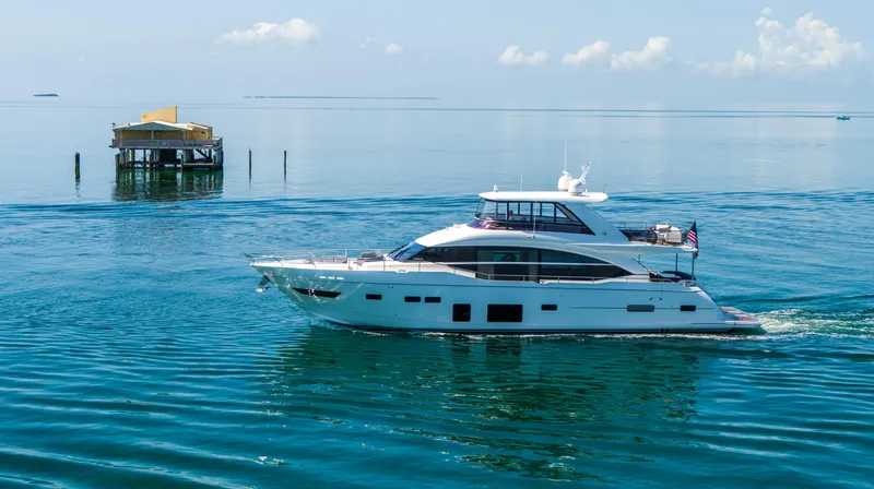 Slide: The Image of 2018 Princess Y75 Motor Yacht cruising on calm blue waters. - 3
