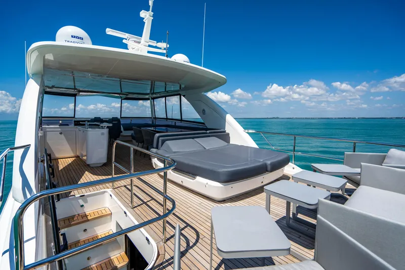 Slide: The Image of 2018 Princess Y75 Motor Yacht deck with lounge seating and ocean view. - 35