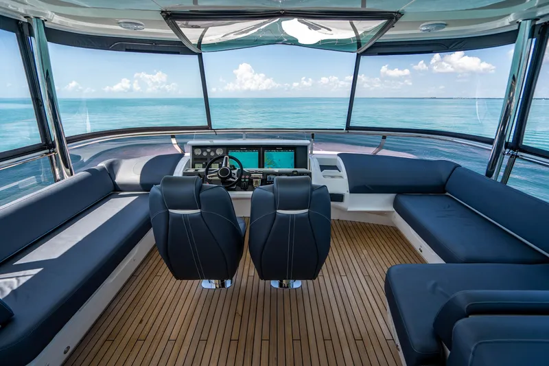 Slide: The Image of 2018 Princess Y75 Motor Yacht helm station with panoramic ocean view. - 41