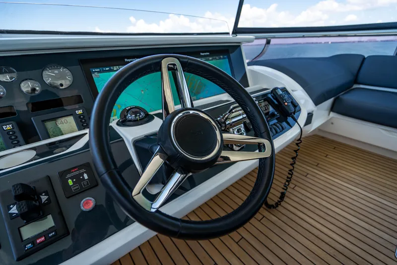 Slide: The Image of Steering wheel and dashboard of a 2018 Princess Y75 Motor Yacht. - 48