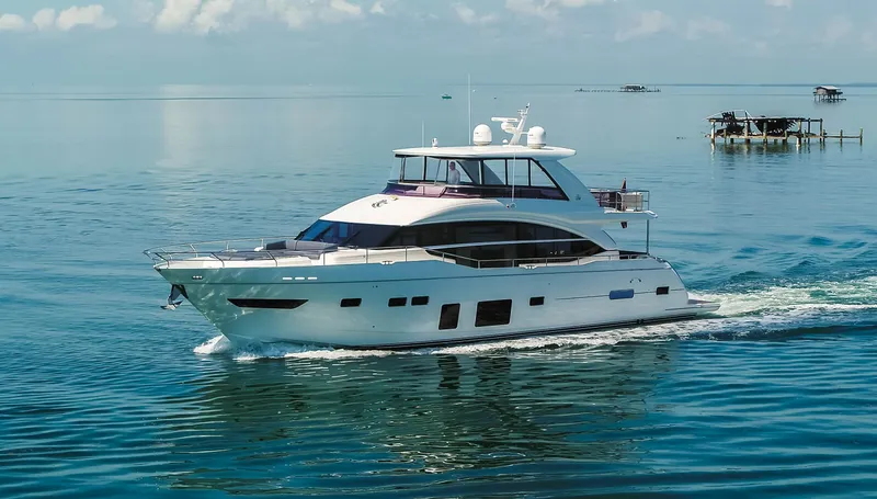 Slide: The Image of 2018 Princess Y75 Motor Yacht cruising on calm blue waters. - 5