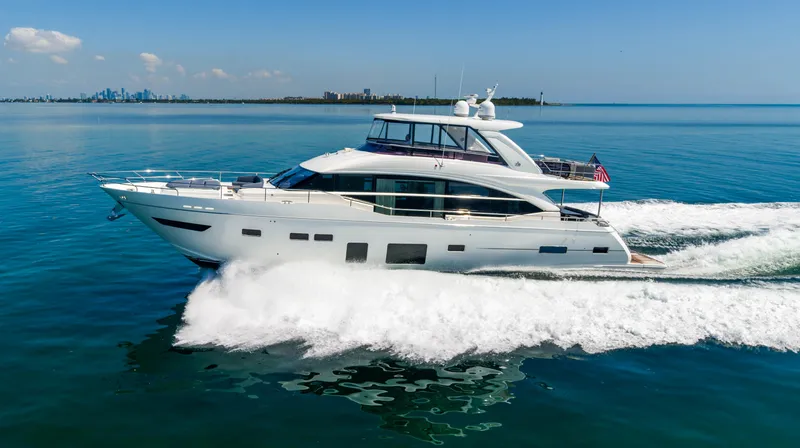 Slide: The Image of 2018 Princess Y75 Motor Yacht cruising on open water. - 9