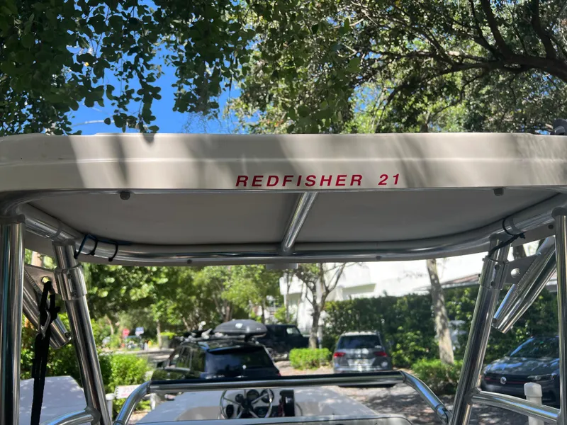 Slide: The Image of 2001 Hewes 21 REDFISHER boat canopy with REDFISHER 21 text. - 12